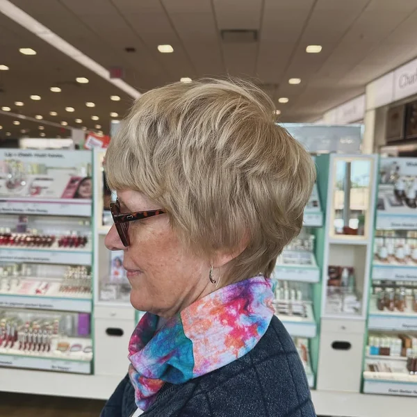 Honey Blonde Layered Pixie with Wispy Fringe