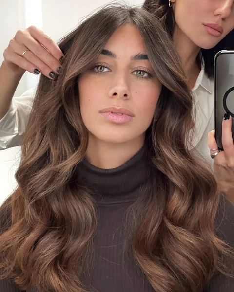 Luxurious Long Brunette Waves with Face-Framing Layers