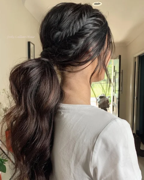 Messy Fishtail Braided Ponytail with Voluminous Waves