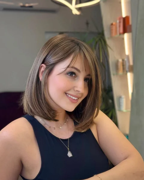 Mid-Length Caramel Bob with Soft Curtain Bangs