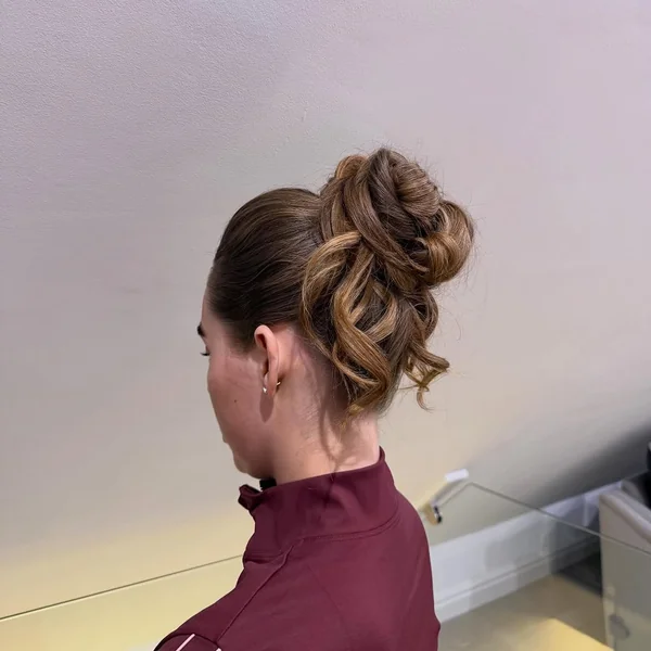 Romantic Low Bun Updo with Chunky Dutch Braid