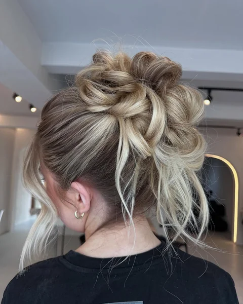 Romantic Undone High Bun with Voluminous Texture