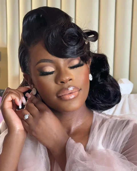 Sculpted Retro Updo with Side-Swept Volume Bang