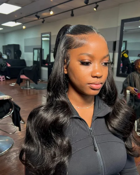 Sleek Half-Up Ponytail with Defined Waves