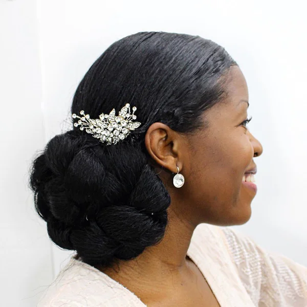 Sleek Low Bun Updo with Rhinestone Adornment