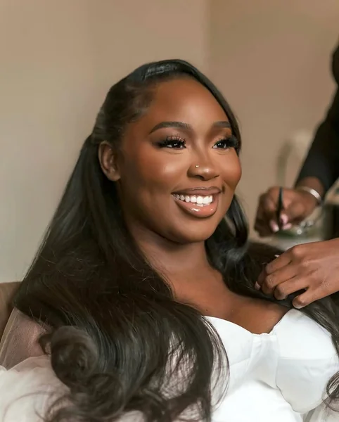 Sleek Middle-Part Half-Up Look with Soft Curls