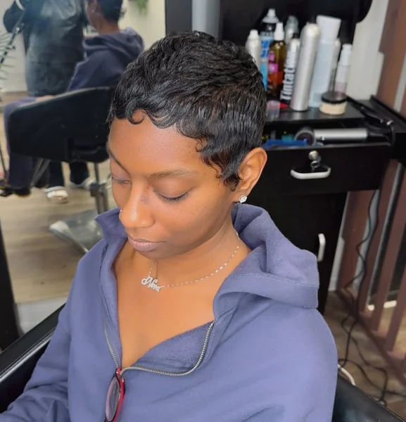 Sleek Sculpted Black Pixie with Defined Swoops