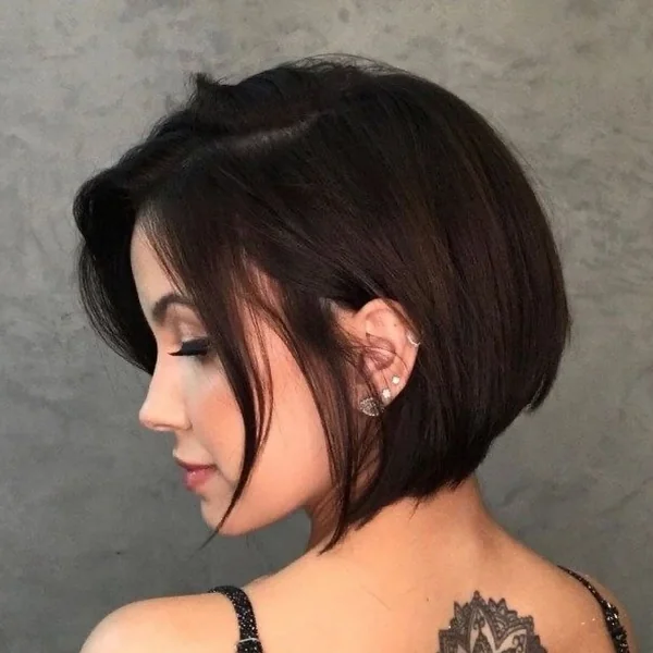Sleek Stacked Brunette Bob with Wispy Side-Swept Fringe