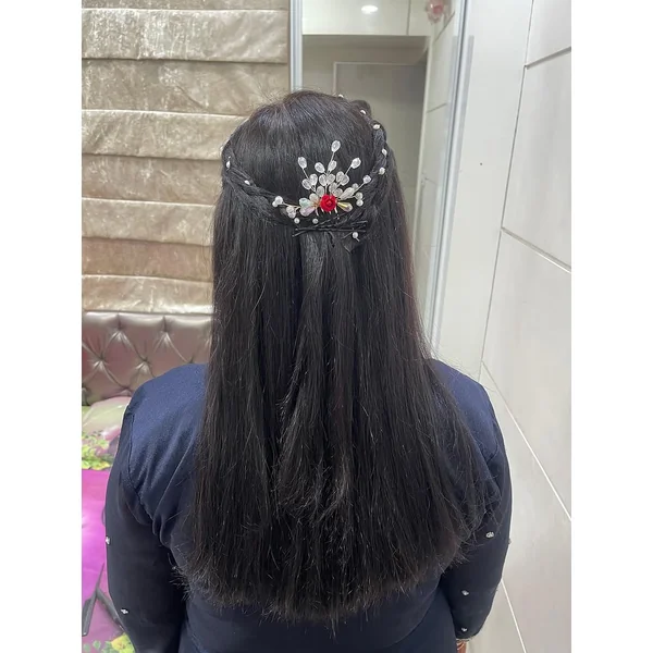 Sleek Twisted Half-Up with Ornate Crystal Statement