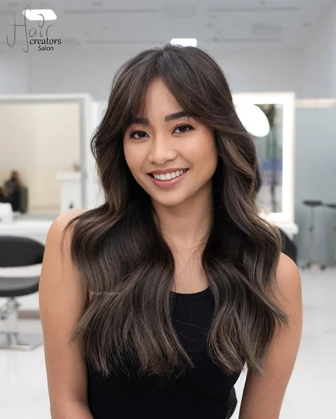 Soft Brunette Butterfly Layers with Blended Highlights