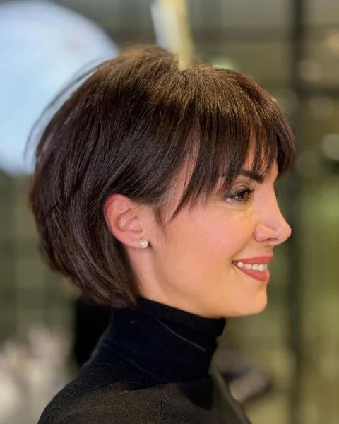Soft Brunette Pixie Bob with Side-Swept Bangs