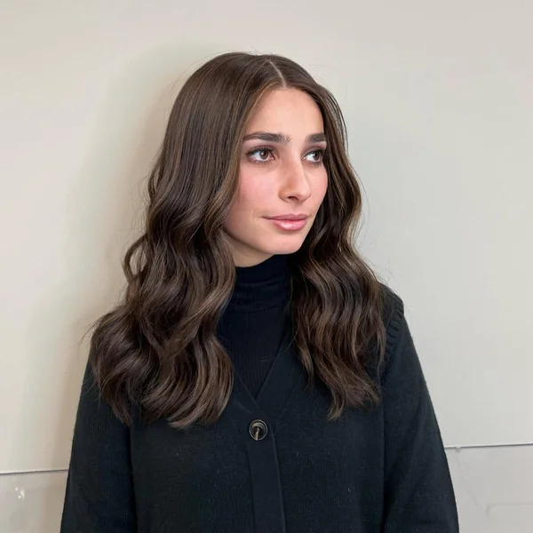 Subtle Brunette Medium Layers with Sun-Kissed Face Frame