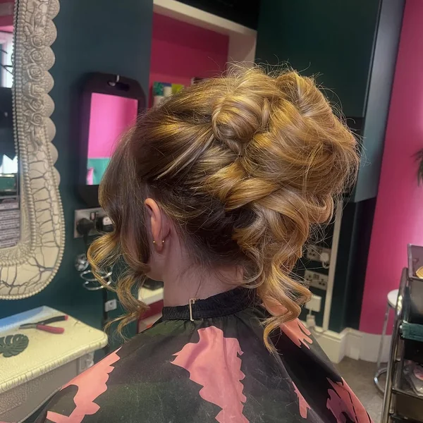 Textured French Twist Updo with Soft Curly Tendrils