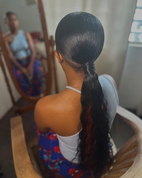 Ultra-Sleek Low Ponytail with Curly Hidden Color