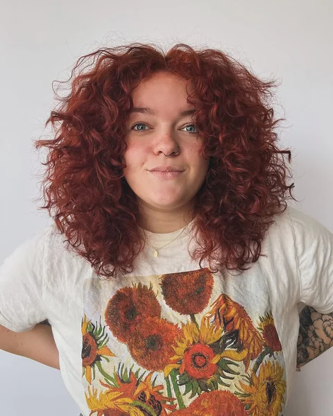 Vibrant Red Layered Curls with Extreme Volume