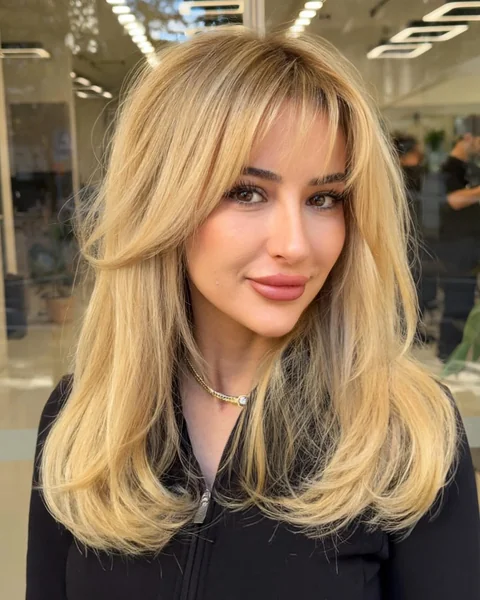 Voluminous 90s Supermodel Blowout with Curtain Bangs