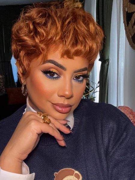 Voluminous Copper Pixie Cut with Curly Texture