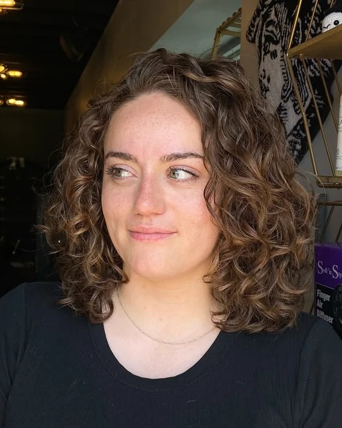 Voluminous Copper-Toned Curls for Natural Shoulder Length Hair