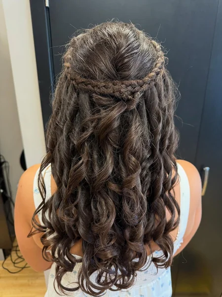 Voluminous Dark Ringlets with Delicate Braided Halo