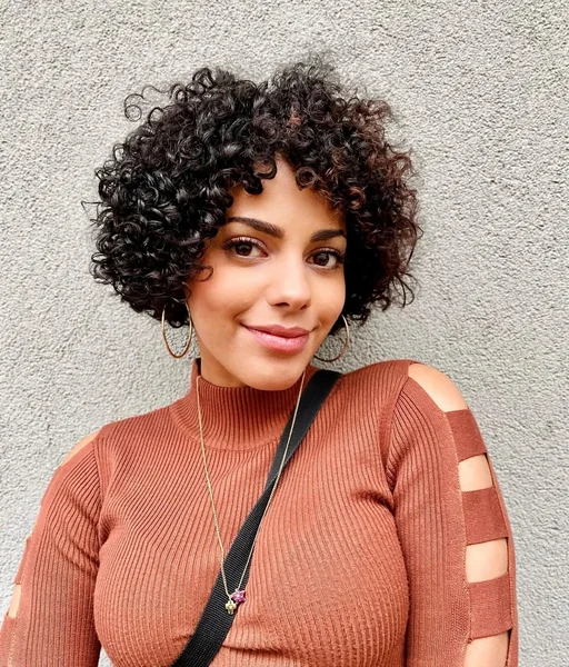 Voluminous Defined Curly Bob with Wispy Fringe