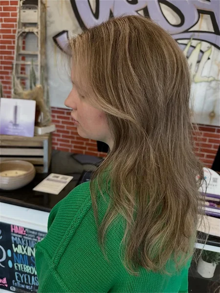 Voluminous Low Ponytail with Face-Framing Layers