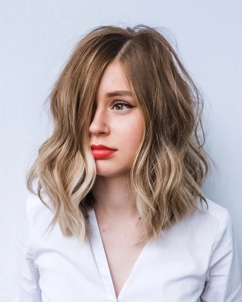 Wavy Blonde Balayage Lob with Deep Side Part
