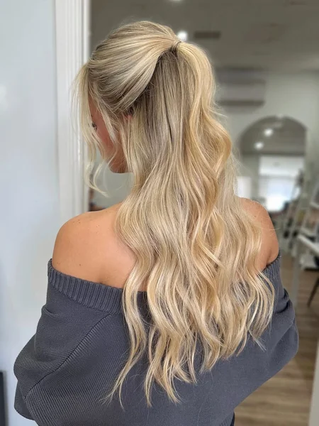 Wavy Blonde Half-Up Ponytail with Face-Framing Volume