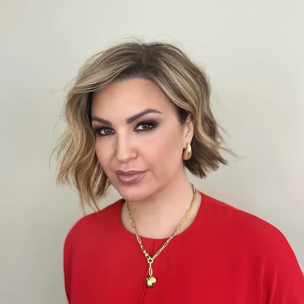 Wavy Dimensional Bob with Deep Side Part and Sweep