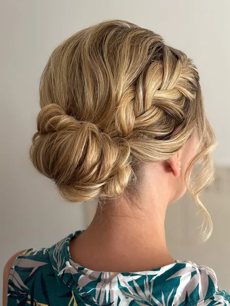 Woven Low Bun Updo with Side Waterfall Braid