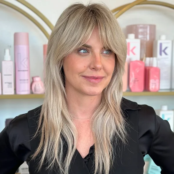 Blonde Medium Shag with Full, Face-Framing Curtain Bangs