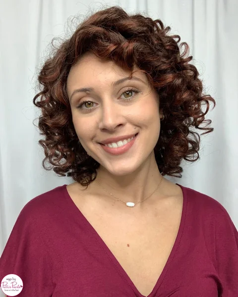 Bouncy Auburn Ringlets with Volumizing Side-Swept Curls