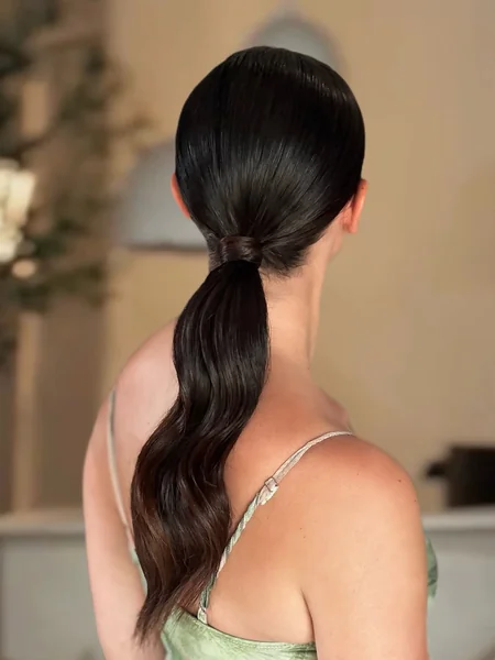 Chic Low Ponytail with Deep Waves and Wrap