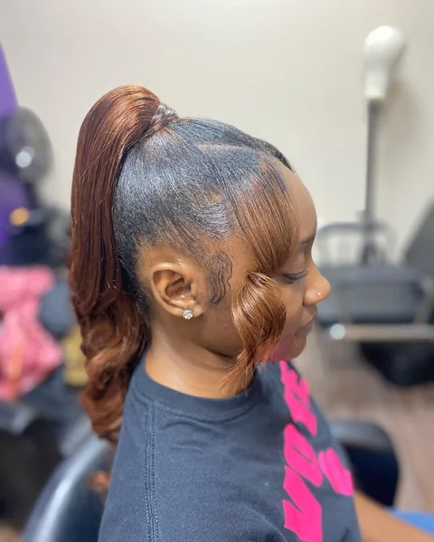 Copper-Toned Low Ponytail with Polished Waves