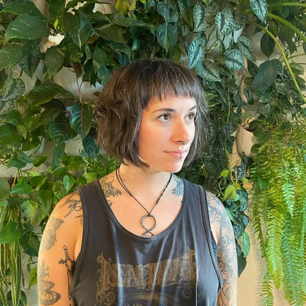 Defined Wet-Look Curly Bob with Braided Detail