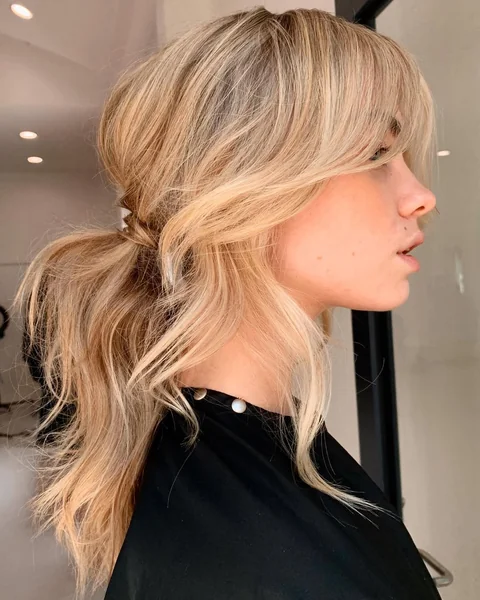 short ponytail with bangs