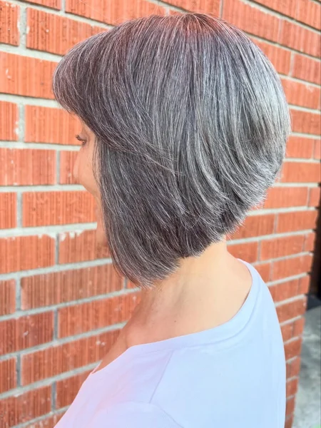 Elegant Silver Inverted Bob with Side-Swept Fringe