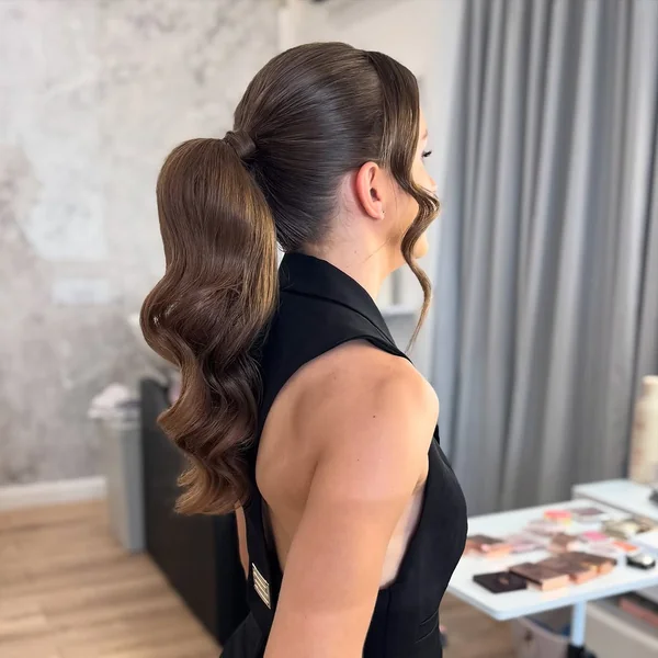 Glossy Mid-Ponytail with Voluminous Deep Curls