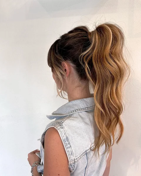 High Textured Ponytail with Face-Framing Prom Bangs