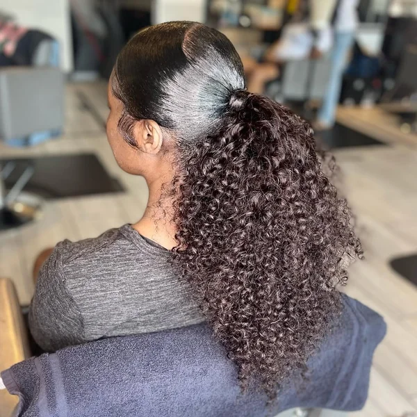 High Side-Parted Ponytail with Long Defined Curls