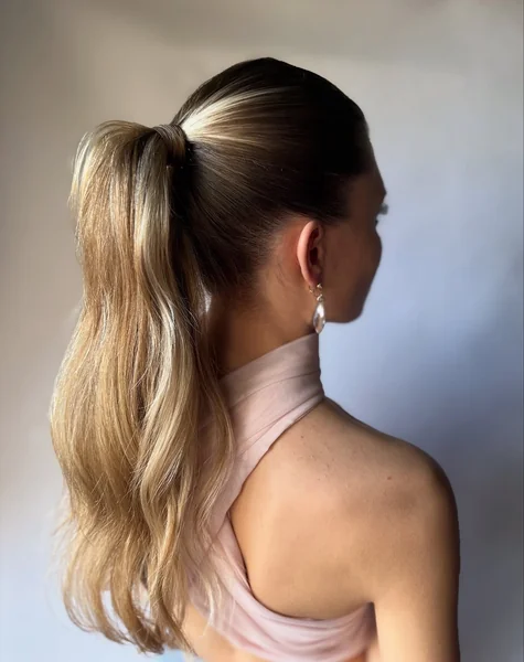 Honey Brown Sleek Mid-Ponytail with Voluminous Waves