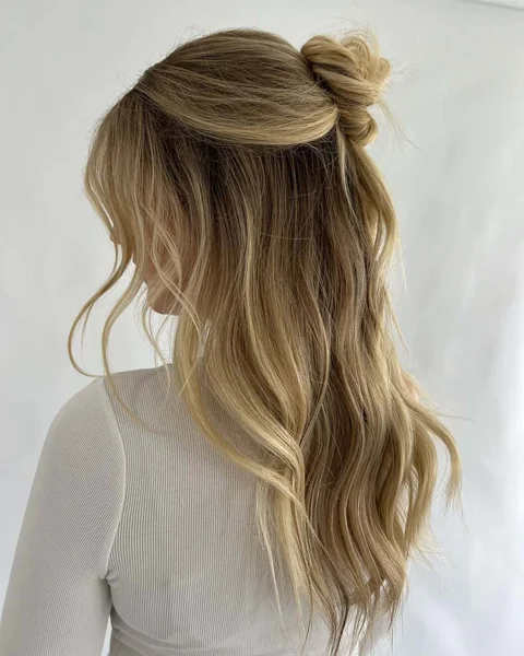 Honey Blonde Half-Up Messy Bun with Waves