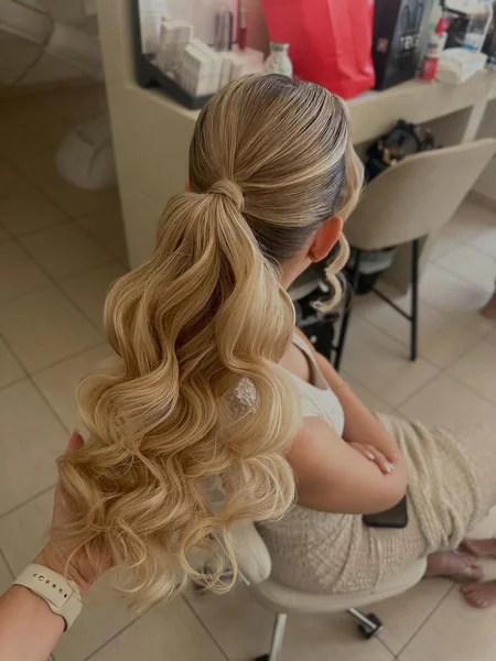 blonde ponytail with bangs