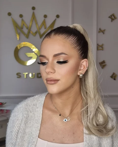 Sleek High Ponytail with Icy Blonde Length and Party Makeup