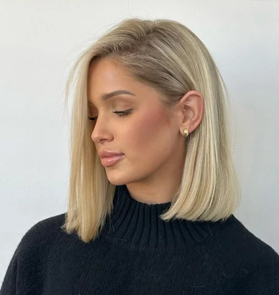 Bold Layered Copper Bob with Soft Curtain Bangs