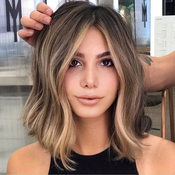 Precision-Cut Ash Blonde Bob with Minimalist Tucked Styling