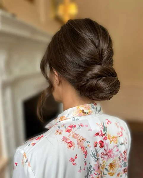 Sleek Mid-Length Brunette Low Ponytail with Soft Side-Swept Fringe