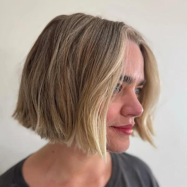 Blunt Bronde Bob with Bright Money Piece Highlights