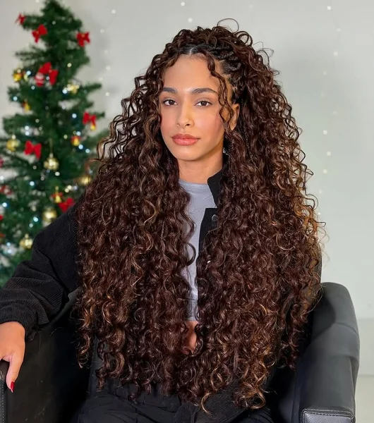 Cascading Espresso Curls with Sun-Kissed Highlights