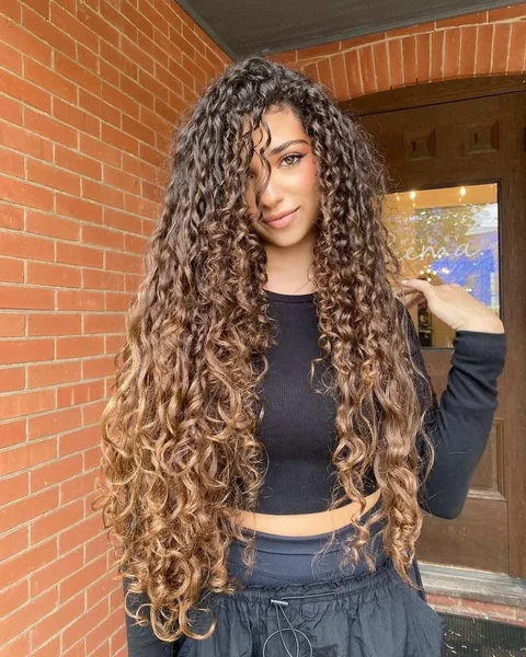Cascading Honey Brown Curls with Massive Natural Volume
