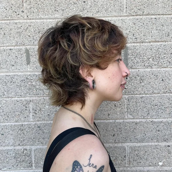 Curly Mullet-Inspired Pixie with Golden Highlights